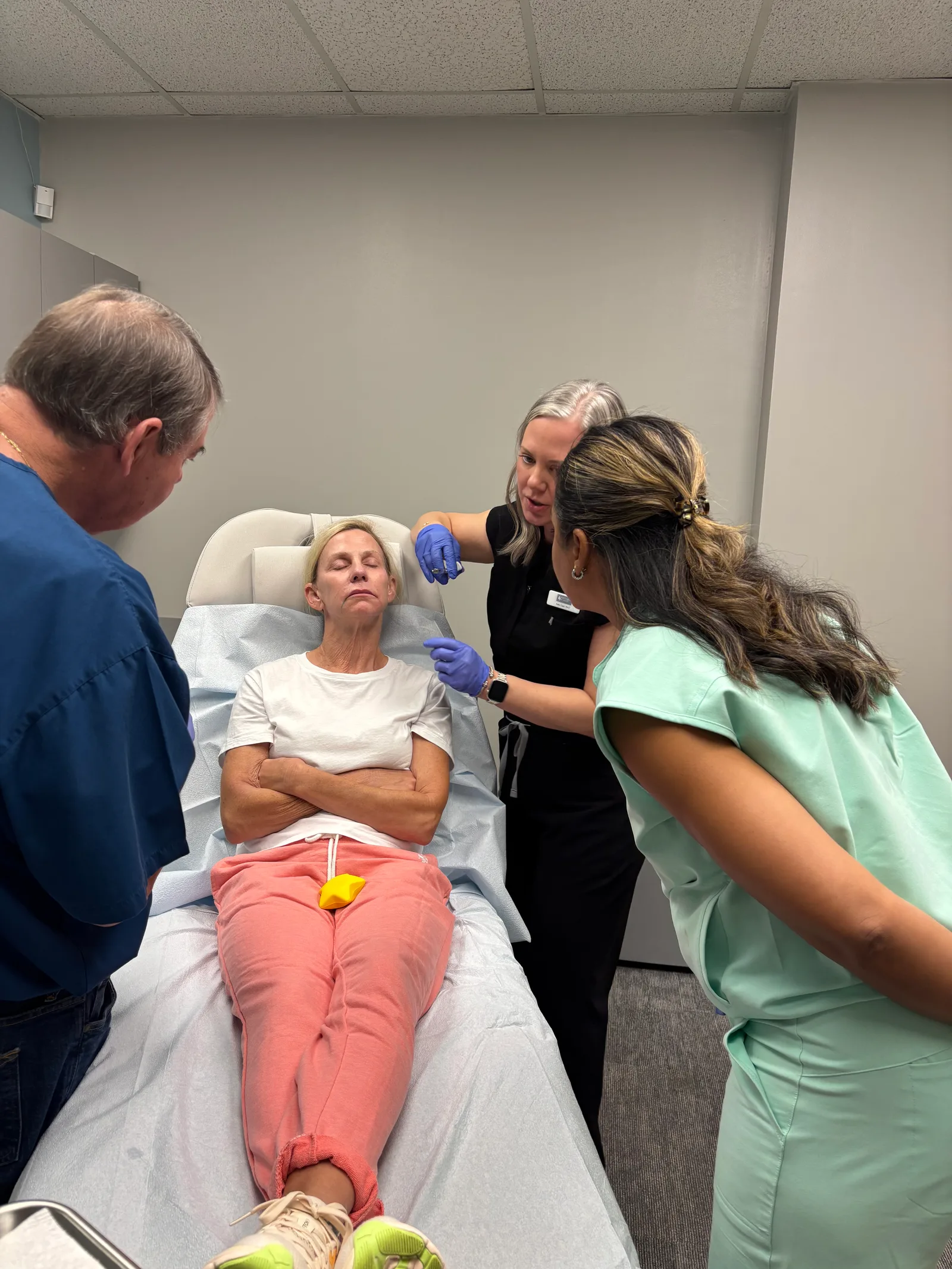 Students and instructors work together at a treatment chair in Savannah