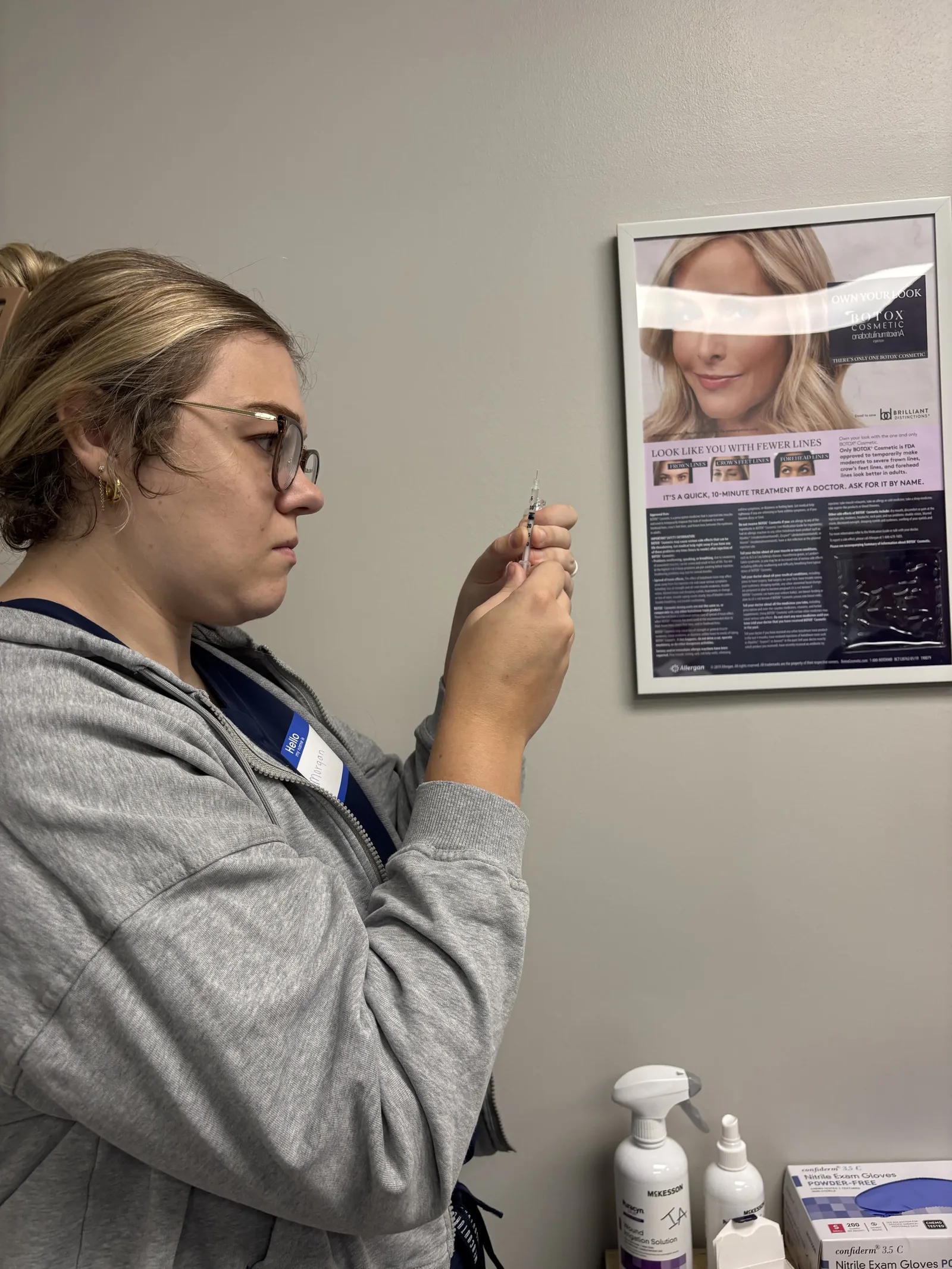 A student prepares an injection during hands-on training in Savannah