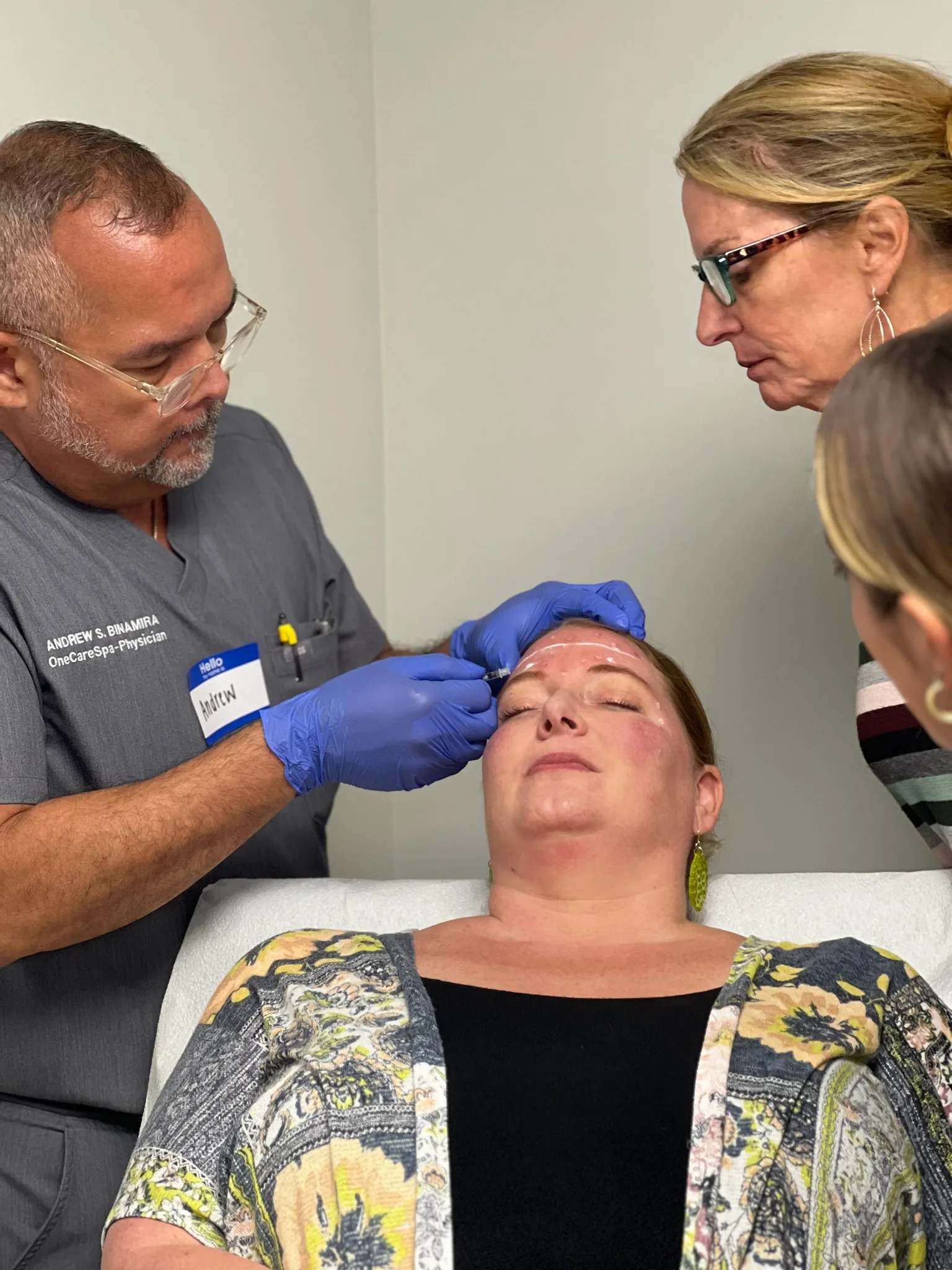 A Savannah participant practices an injection while an instructor supervises beside the model